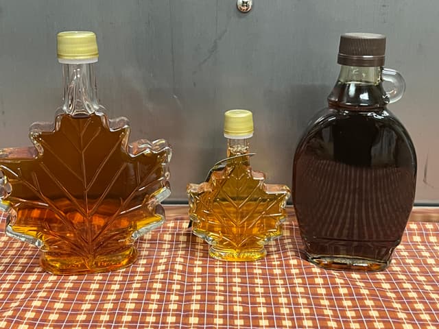 More specialty maple syrup containers. The maple leaf glass bottle is shaped like a maple leaf, just like it sounds. The bourbon barrel aged syrup is very dark.